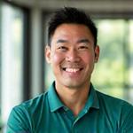 Portrait of Coach David Chen, a fit and encouraging certified fitness specialist.