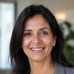 Portrait of Dr. Anya Sharma, a warm and empathetic certified nutritionist.